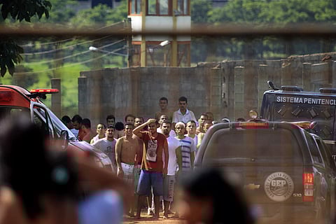 Prisoners try to contact relatives after a rebellion at Brazil's Colonia Agroindustrial prison | AP