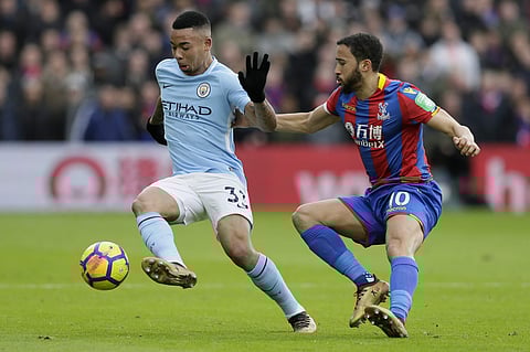 Manchester City's Gabriel Jesus, left, competes for the ball with Crystal Palace's Andros Townsend during the English Premier League soccer match between Crystal Palace and Manchester City at Selhurst Park. | AP