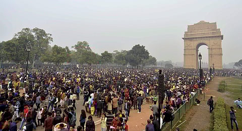 People thronging India Gate in New Delhi on the first day of the New Year on Monday led to massive traffic jams in the city | pti