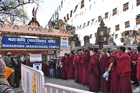 Police personnel stand guard near the premises of Mahabodhi Temple in Bodh Gaya on Saturday. PTI Photo