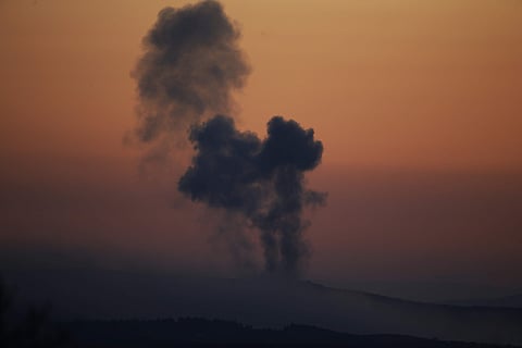 Plumes of smoke rise on the air from inside Syria, as seen from the outskirts of the border town of Kilis, Turkey, Saturday, Jan. 20, 2018. (Associated Press)