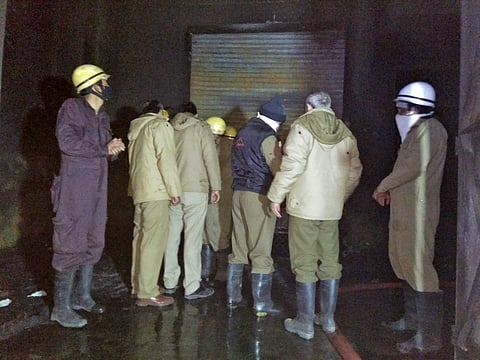 Fire fighters at the site of a fire at a factory in Bawana industrial area in northwest Delhi on Saturday evening. | PTI