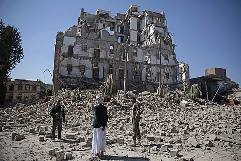 Houthi Shiite rebels inspect the rubble of the Republican Palace that was destroyed by Saudi-led airstrikes in Sanaa (File | AP)