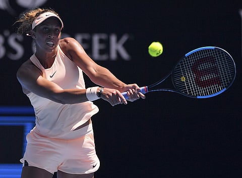 United States' Madison Keys hits a backhand return to France's Caroline Garcia during their fourth round match at the Australian Open tennis championships in Melbourne, Australia. | AP