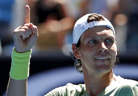 Tomas Berdych of the Czech Republic reacts after defeating Italy's Fabio Fognini during their fourth round match at the Australian Open tennis championships in Melbourne. | Photo: AP