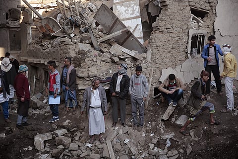 People gather at the site of a Saudi-led airstrike near Yemen’s Defense Ministry complex in Sanaa, Yemen, Saturday, Nov. 11, 2017. (AP Photo/Hani Mohammed)