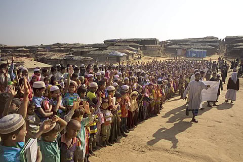 Rohingya children and refugees raise their hands and shout that they won't go back to Myanmar during a demonstration at Kutupalong near Cox's Bazar, Bangladesh | AP