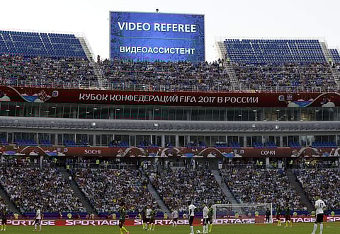 In this Sunday, June 25, 2017 file photo, a giant screen reports an incident is being investigated by VAR (Video Assistant Referee) during the Confederations Cup, Group B soccer match between Germany and Cameroon. | AP