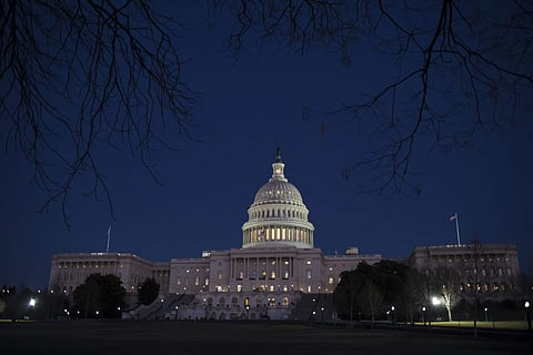In this file photo, with no apparent indications of a breakthrough in the Senate to avoid a government shutdown, the Capitol is illuminated in Washington. | AP