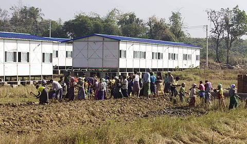 Laborers work at newly-built repatriation camps prepared for the planned return of Rohingya refugees from Bangladesh | AP