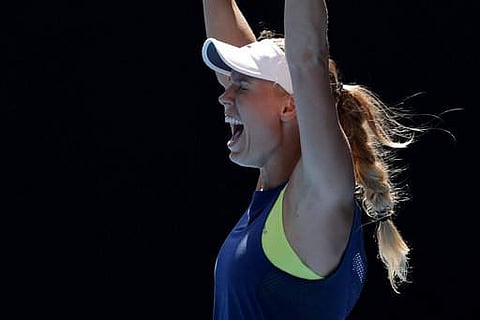 Denmark's Caroline Wozniacki celebrates after defeating Belgium's Elise Mertens in their semifinal at the Australian Open tennis championships in Melbourne. | Photo: AP