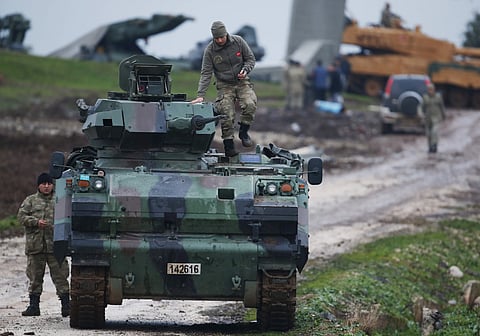 Turkish soldiers on an armored personnel carrier secure a staging area oduring the offensive on a Kurdish-held enclave in northern Syria (File | AP)