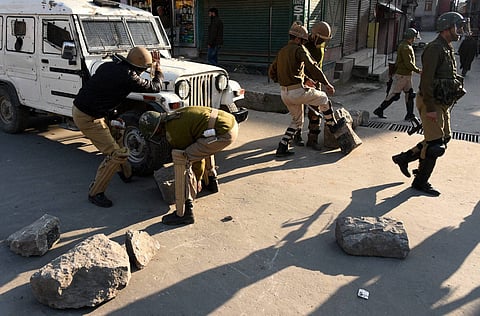 In this file photo, police removes the barricades put up by angry protesters during clashes which erupted after the killing of two youth allegedly in Army firing following the molestation bid by a Jawan at Handwara in Kupwara district of north Kashmir at