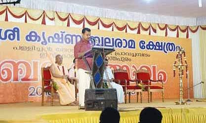 Mayor V K Prasanth addresses the audience during the first anniversary of ISKCON’s Sri Krishna Balarama temple in Pallichal on Saturday