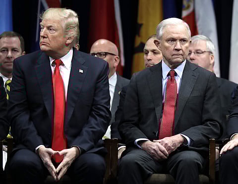 In this Dec. 15, 2017, file photo, President Donald Trump and Attorney General Jeff Sessions attend the FBI National Academy graduation ceremony in Quantico, Va. | AP