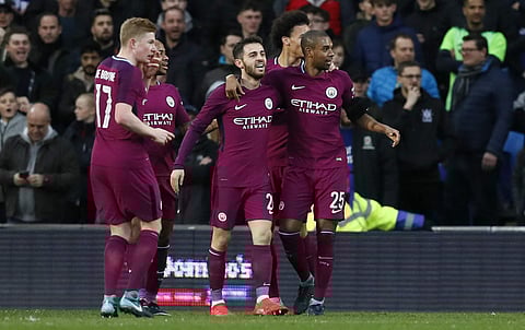 Manchester City players react after a goal by Bernardo Silva, center, was disallowed during the English FA Cup fourth round soccer match between Cardiff City and Manchester City. | AP