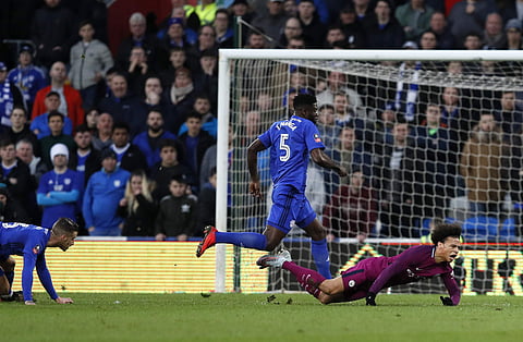 Manchester City's Leroy Sane, right, falls after being fouled by Cardiff City's Joe Bennett, left, during the English FA Cup fourth round soccer match between Cardiff City and Manchester City. | AP