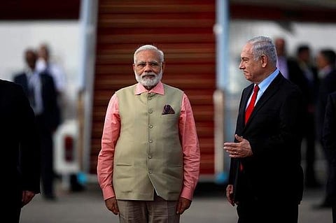 Indian Prime Minister Narendra Modi stands next to Israeli Prime Minister Benjamin Netanyahu during a farewell ceremony upon Modi's departure from Israel at Ben Gurion International Airport, near Tel Aviv, Israel. (Photo: Reuters)