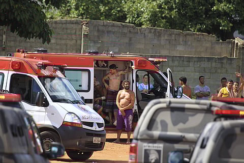 Injured prisoners receive medical care in an ambulance after the prison riot in Brazil | AP