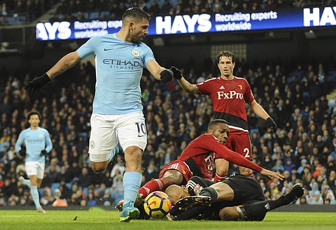 Watford's goalkeeper Heurelho Gomes collides with Watford's Molla Wague while Sergio Aguero scores goal for Manchester City. (Photo |AP)