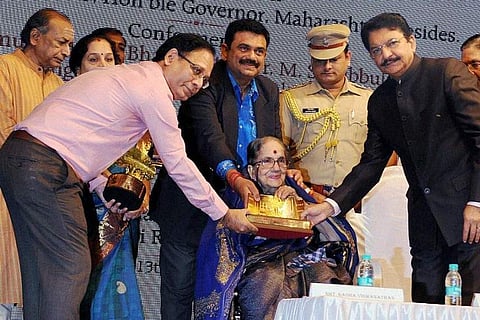 In this file image dated 13 September 2015, Governor of Maharashtra Vidyasagar Rao (R) presenting 'Sri Shanmukhanand Dr. MS Subbulakshmi Sangeetha Pracharya' special award to the 80 year old Radha Viswanathan, daughter of MS Subbulakshmi. (File | PTI)