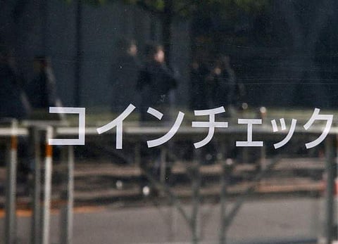 Cryptocurrency exchange Coincheck's signboard is pictured in front of a building where their office is located, in Tokyo. (Photo: Retuers)