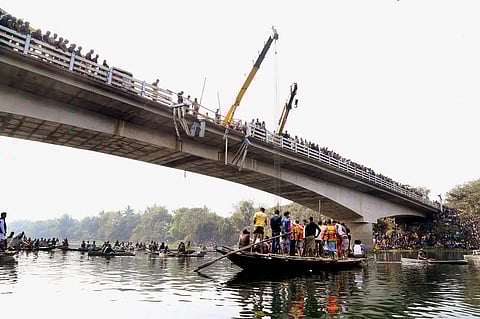 Rescue works underway after a public bus fell into the Bhairab river in Murshidabad district on Monday. | PTI