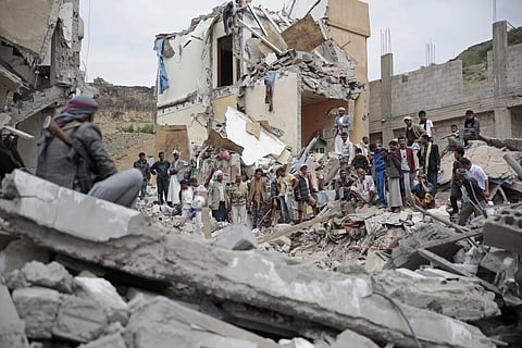 A file image of people inspecting the rubble of houses destroyed by Saudi-led airstrikes in Yemen. (Photo | AP)