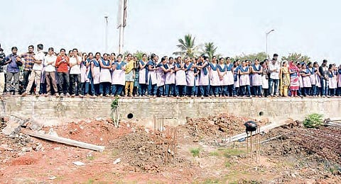 Students and alumni of SRR & CVR Governent College staging protest against ‘illegal private construction’ on college land;