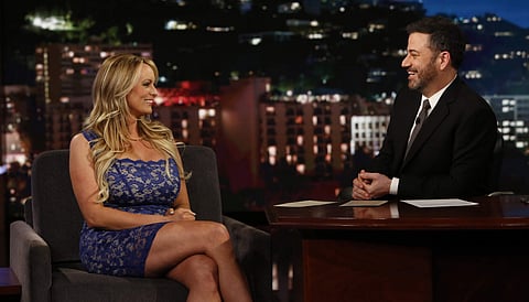 This image released by ABC shows adult film star Stormy Daniels, left, laughs with host Jimmy Kimmel during an appearance on 'Jimmy Kimmel Live!' | AP