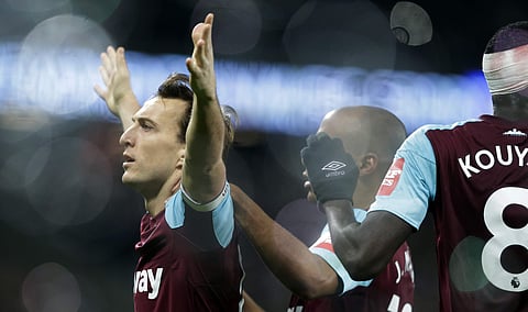 West Ham United's Mark Noble, left, celebrates after scoring from the penalty sport for his side's first goal during their English Premier League soccer match between West Ham United and Crystal Palace. | AP