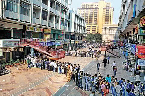 People queue up outside ATMs in New Delhi to withdraw cash after last year’s demonetisation. (File | Express Photo Service)