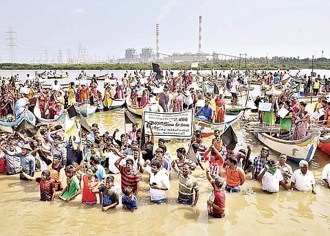 Fishermen of Kattupakkam protesting against the dumping of ash in the Kosasthalaiyar by thermal power plants at Ennore in Chennai, on Wednesday | P Jawahar