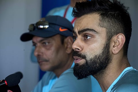 Indian cricket captain Virat Kohli, right, with coach Ravi Shastri, center, in Cape Town | AP