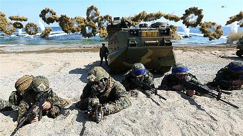 South Korean and US soldiers take a position during annual joint military drills in a South Korean coast, March 12, 2016. (File | AFP)