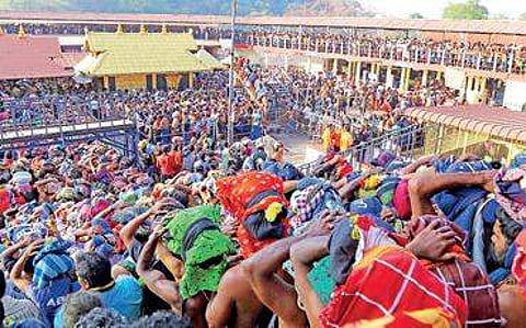 The rush of pilgrims near the sreekovil of Sabarimala Lord Ayyappa temple on Thursday | SHAJI VETTIPURAM
