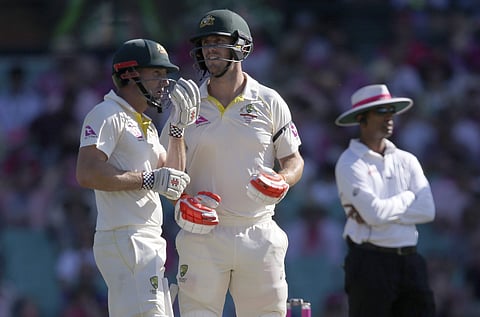 Australian brothers Shaun Marsh, left, and Mitchell Marsh take a break between overs while batting against England during the third day of their Ashes cricket test match in Sydney, Saturday, Jan. 6, 2018. | AP