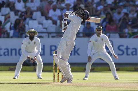 India batsman Shikhar Dhawan hits a high ball which saw him dismissed for 16 runs in India's first innings on the first day of the first test between South Africa and India at Newlands Stadium, in Cape Town. | AP