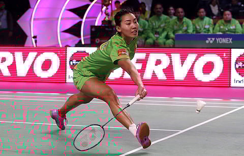 Canadian player Michelle Li of North Eastern Warriors returns a shot to Indian player Saina Nehwal of Awadhe Warriors during the women's singles of Vodafone Premier Badminton League (PBL) in New Delhi. | AP
