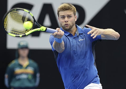 Ryan Harrison of the U.S. plays a shot in his semifinal match against Alex de Minaur of Australia during the Brisbane International tennis tournament in Brisbane, Australia, Saturday, Jan. 6, 2018. | AP