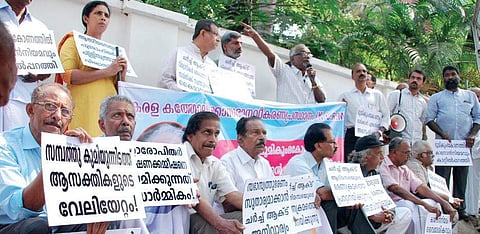 Participants at a meet conducted by KCRM, in connection with the land scam in the Catholic Church, in front of the Major Archbishop’s house in Kochi | K Shijith