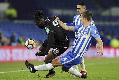 Crystal Palace's Bakary Sako fights for the ball with Brighton's Uwe Hunemeier, right, during their English FA Cup clash | AP