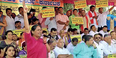 BJP leaders Shobha Karandlaje, B S Yeddyurappa and R Ashok stage a protest over the killing of Deepak Rao at Anand Rao Circle in Bengaluru on Monday | Express