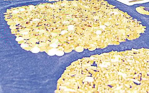 The seized fake gold coins and ornaments