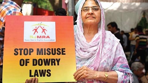 A woman protesting against the misuse of anti-dowry laws