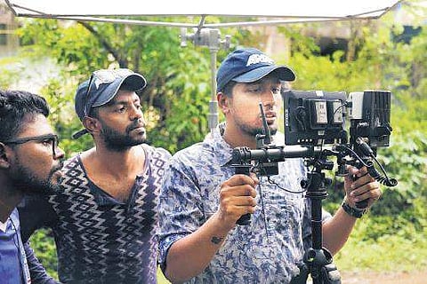 Sreeraj Raveendran (right) with director Prasobh Vijayan (centre)