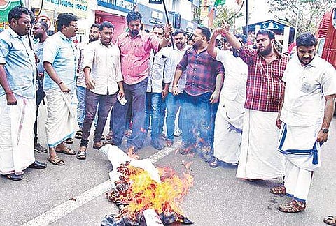 Youth Congress activists burning Mukesh in effigy near the MLA’s office at Anandavalleswaram