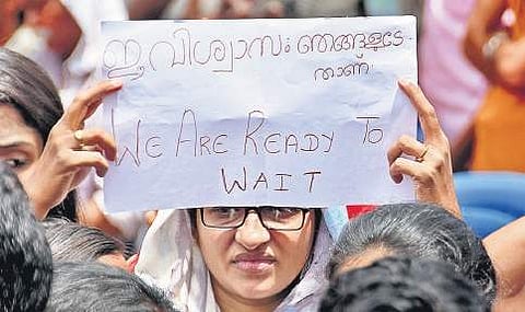 Devotees staging a protest in front of Hanuman Swamy Temple at PMG Junction. The protest was held under the aegis of Yogakshema Sabha with support from other outfits
