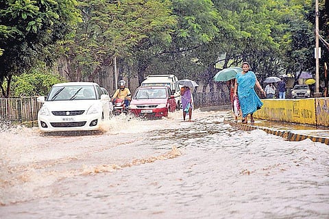 A waterlogged road at Jaydev Vihar Square in Bhubaneswar on Friday (Photo | Express)
