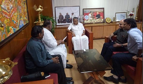 Nayani Narshimha Reddy handed over a cheque of Rs 25 crore to Kerala Chief Minister Pinarayi Vijayan. (Photo | twitter @ANI)